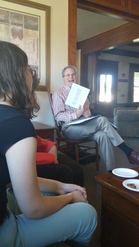 Dr. Geoffrey Block laughs as he explains a particularly difficult musical theater crossword puzzle.